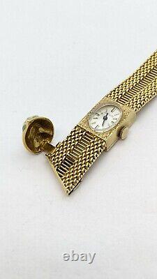 Montre-bracelet en or jaune 14 carats LeCoultre vintage avec fermoir émaillé, 62,6 grammes.
